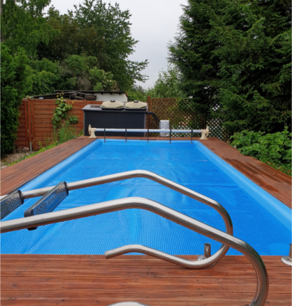 new swimming pool and spa with waterfall features and stone coping