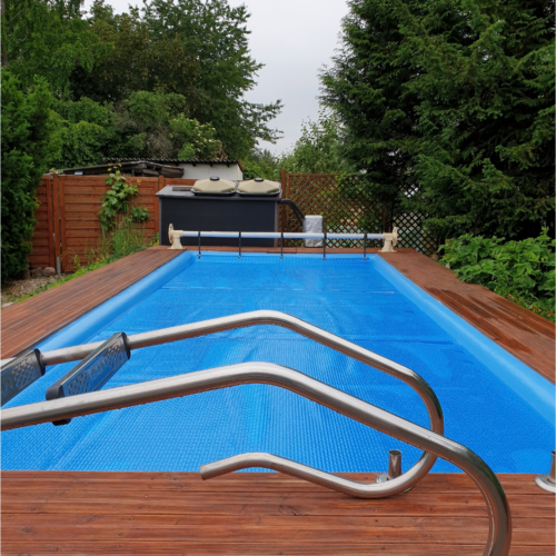 new swimming pool and spa with waterfall features and stone coping